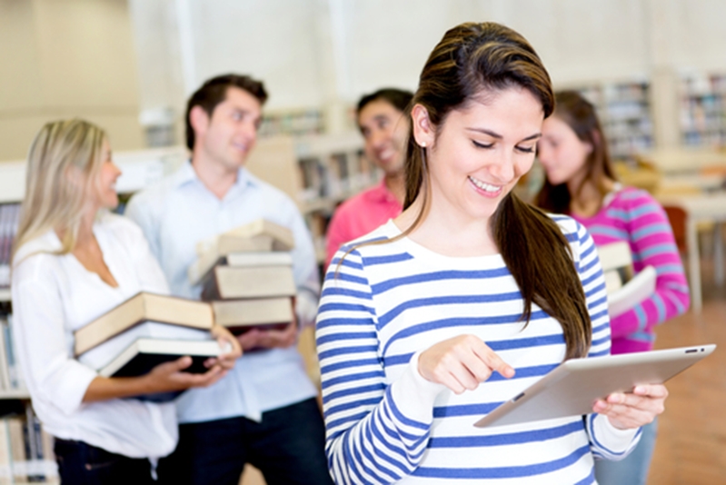 Many students are turning to e-books for better costs and convenience.